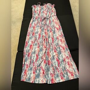 Jumpsuit can be strapless or worn with included straps